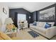 Cozy living room with a large window, stylish decor and comfortable seating at 2679 Metro Sevilla Dr # 101, Orlando, FL 32835