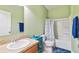 Cozy bathroom featuring a single sink vanity, toilet, and a shower-tub combo at 2951 Irish Peach Dr, Winter Garden, FL 34787