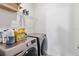 A tidy laundry room with modern washer and dryer units and wire shelving at 2951 Irish Peach Dr, Winter Garden, FL 34787