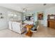 Inviting living room featuring a large entertainment center, comfortable seating, bright windows, and a ceiling fan at 2951 Irish Peach Dr, Winter Garden, FL 34787