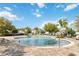 A community pool surrounded by lounge chairs and manicured landscaping at 2951 Irish Peach Dr, Winter Garden, FL 34787