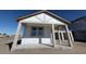 Inviting front porch showcasing a new home's architectural details and windows at 30125 Misty Pines Rd, Mount Dora, FL 32757