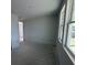 Living room with natural light from large windows at 30125 Misty Pines Rd, Mount Dora, FL 32757