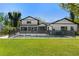 Large backyard featuring a pool with black -proof fence and lush lawn at 315 E 6Th Ave, Windermere, FL 34786