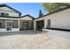 Backyard with stone patio, exterior bar, covered patio, and sliding doors at 315 E 6Th Ave, Windermere, FL 34786
