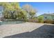 Large backyard featuring gray stone patio with black -proof fence surrounding a pool at 315 E 6Th Ave, Windermere, FL 34786