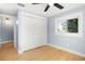 Cozy bedroom with hardwood floors, ceiling fan, closet, and light blue walls at 315 E 6Th Ave, Windermere, FL 34786