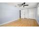Comfortable bedroom with hardwood floors, ceiling fan, and closet at 315 E 6Th Ave, Windermere, FL 34786