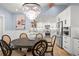 Elegant dining room featuring a stylish chandelier and seamless access to the modern kitchen at 315 E 6Th Ave, Windermere, FL 34786