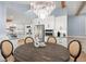 Elegant dining room featuring a stylish chandelier and seamless access to the open concept modern kitchen at 315 E 6Th Ave, Windermere, FL 34786