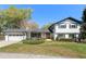 Charming two-story home with landscaped front yard and a classic white and black exterior at 315 E 6Th Ave, Windermere, FL 34786