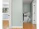 Hallway leading to the laundry room and another bedroom at 315 E 6Th Ave, Windermere, FL 34786