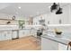 Modern kitchen with stainless steel appliances, white cabinets, stylish countertops, and open design at 315 E 6Th Ave, Windermere, FL 34786