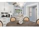 Bright kitchen with custom cabinetry, stainless steel appliances, and a breakfast nook with modern chandelier at 315 E 6Th Ave, Windermere, FL 34786