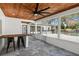 Inviting screened patio with bar, seating, and backyard view with a pool at 315 E 6Th Ave, Windermere, FL 34786