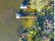 Overhead aerial view showcasing waterfront properties with docks at 3279 Landing Vw, Tavares, FL 32778