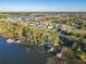 Aerial view of waterfront homes showcasing private docks and community at 3279 Landing Vw, Tavares, FL 32778