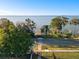 Breathtaking aerial view showcasing the property's waterfront location, private dock, and scenic surroundings at 3279 Landing Vw, Tavares, FL 32778