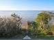 Stunning aerial view featuring the property's private dock leading to the tranquil lake at 3279 Landing Vw, Tavares, FL 32778