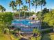 Etowah: A resort-style community pool with lush landscaping, sun loungers, and a cabana at 3279 Landing Vw, Tavares, FL 32778