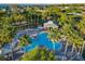 Resort-style community pool with lounge chairs, palm trees, and a shaded pavilion for residents at 3279 Landing Vw, Tavares, FL 32778
