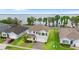 Desirable exterior view of the home with manicured lawn and water view at 3279 Landing Vw, Tavares, FL 32778