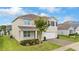 Inviting home with landscaped garden and attached two-car garage at 3279 Landing Vw, Tavares, FL 32778