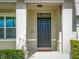 Stylish front door entrance with modern design at 3279 Landing Vw, Tavares, FL 32778