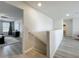 Hallway connecting the living area to other parts of the home, offering smooth transitions and natural light at 3279 Landing Vw, Tavares, FL 32778