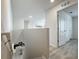 A well-lit hallway providing seamless flow throughout the home at 3279 Landing Vw, Tavares, FL 32778