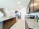 Well-equipped kitchen featuring stainless steel appliances, granite countertops, and ample cabinet space for storage at 3279 Landing Vw, Tavares, FL 32778