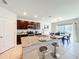 Modern kitchen with granite countertops, stainless steel appliances, and a breakfast bar for casual dining at 3279 Landing Vw, Tavares, FL 32778