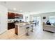 Open kitchen featuring granite countertops, stainless steel appliances and bar stool seating at 3279 Landing Vw, Tavares, FL 32778