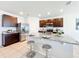 Bright kitchen with stainless steel appliances, granite counters, and a large center island with seating at 3279 Landing Vw, Tavares, FL 32778