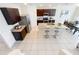Aerial view of the kitchen, featuring granite countertops, stainless steel appliances, and a center island at 3279 Landing Vw, Tavares, FL 32778