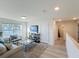 Upstairs living space filled with natural light, offering comfortable seating, and scenic views at 3279 Landing Vw, Tavares, FL 32778