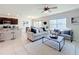 Open-concept living space with a view of the lake, seamlessly connects the kitchen and dining area at 3279 Landing Vw, Tavares, FL 32778