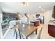 Open living space with a dining area and modern kitchen that creates a comfortable flow for entertaining at 3279 Landing Vw, Tavares, FL 32778