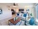 An open-concept living space with a seamless flow between the living room, kitchen, and dining area at 3279 Landing Vw, Tavares, FL 32778