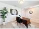 Stylish office area featuring modern decor, neutral walls and wood floors, creating an elegant and functional workspace at 3279 Landing Vw, Tavares, FL 32778