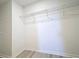 Walk-in closet featuring wire shelving and luxury vinyl plank flooring at 3279 Landing Vw, Tavares, FL 32778