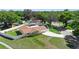 Aerial view of a charming home with a fenced yard, swimming pool, and mature trees at 333 Crystal Cir, Oviedo, FL 32765