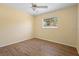 Bedroom features updated flooring, ceiling fan, and a window overlooking the yard at 333 Crystal Cir, Oviedo, FL 32765