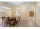 Cozy dining room featuring a wooden table with seating for six and modern lighting at 333 Crystal Cir, Oviedo, FL 32765