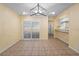 Bright dining room with sliding glass doors, tile flooring, and modern light fixture at 333 Crystal Cir, Oviedo, FL 32765