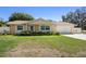 Charming single-story home featuring a well-maintained lawn and an attached two-car garage at 333 Crystal Cir, Oviedo, FL 32765
