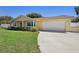 Single-story home with a well-maintained lawn, updated exterior paint, and a two-car garage at 333 Crystal Cir, Oviedo, FL 32765