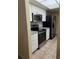 Updated kitchen features stainless steel appliances, granite countertops, and white cabinets at 333 Crystal Cir, Oviedo, FL 32765