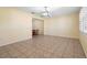 Spacious living room with neutral paint, tile flooring, and modern lighting fixture at 333 Crystal Cir, Oviedo, FL 32765
