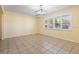 Bright living room offers a large window, tile floors and a modern light fixture at 333 Crystal Cir, Oviedo, FL 32765